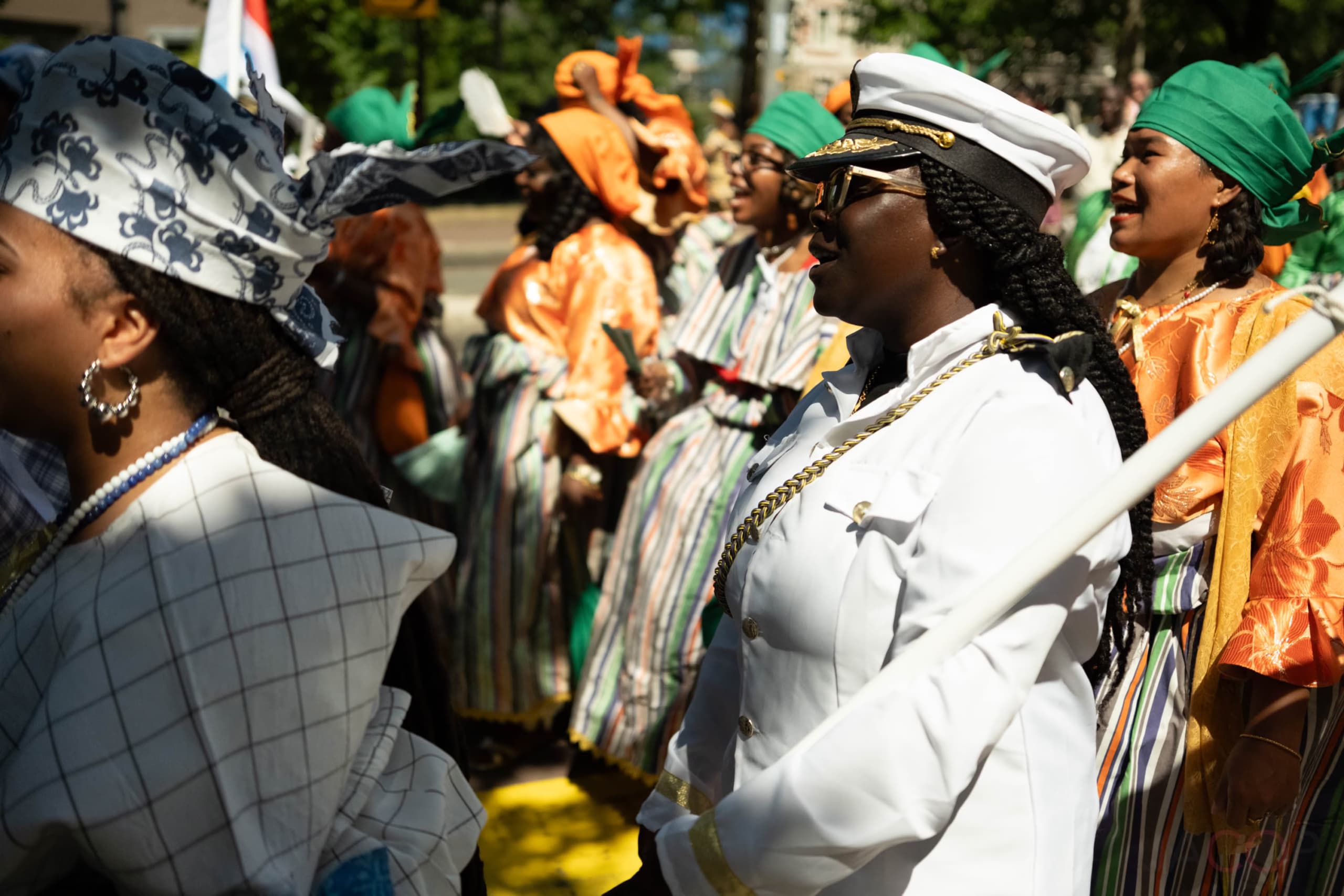 Participants in the Bigi Spikri during Keti Koti 2025, wearing traditional attire, walking in the commemorative procession.